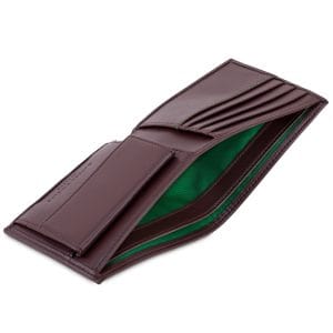 Chestnut brown coin wallet with emerald green interior, designed with dedicated slots for cards, a secure coin pocket, and RFID protection.