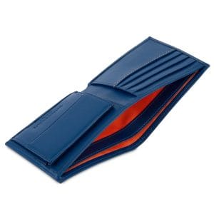Open navy blue coin wallet with orange lining, designed with a gusseted coin pocket, card slots, and a dedicated space for notes.